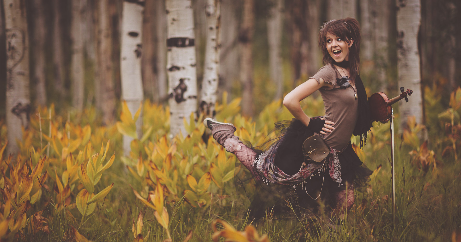 Lindsey Stirling in a forest.