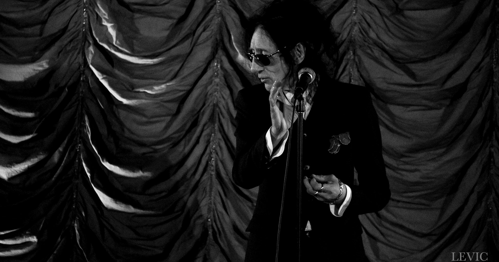 John Cooper Clarke performing spoken word in Auckland, 2018. Image by Levic Visual.
